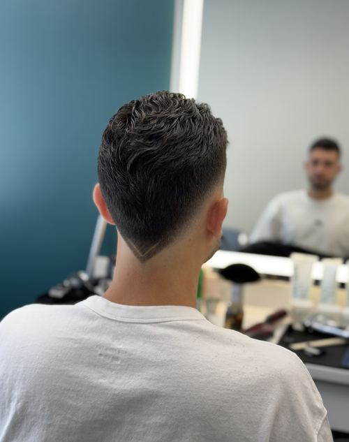 Skin fade haircut with a precise neckline design